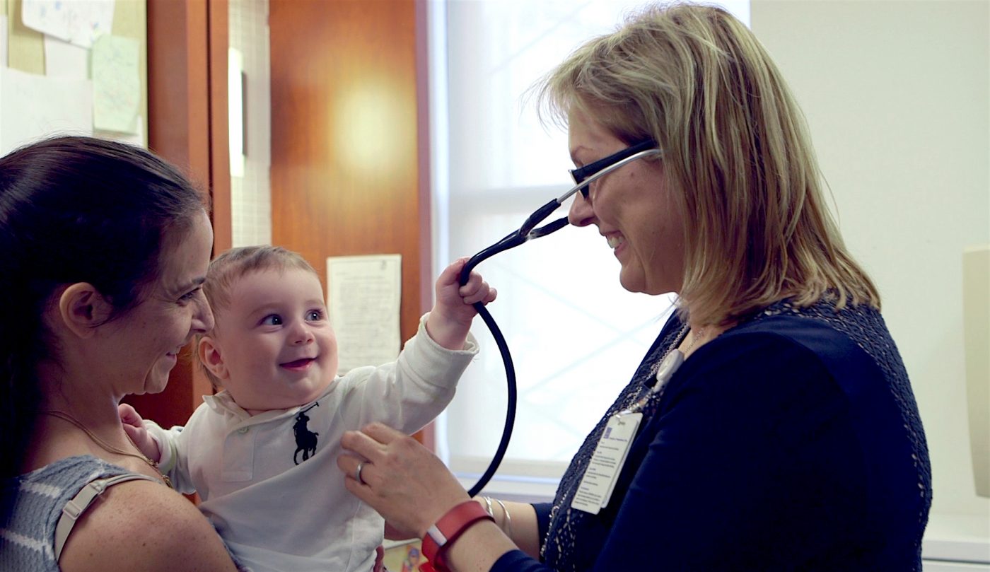Baby pulling stethoscope. Photo courtesy Mount Sinai Parenting Center