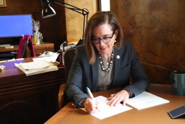Gov Kate Brown of Oregon signs legislation for education funding into law