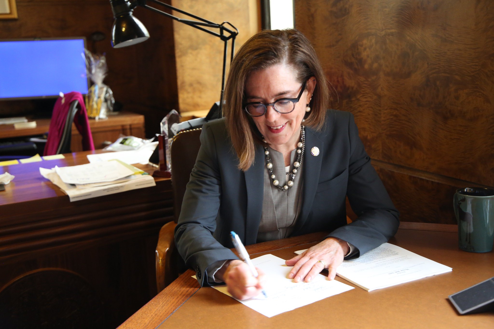 Gov Kate Brown of Oregon signs legislation for education funding into law